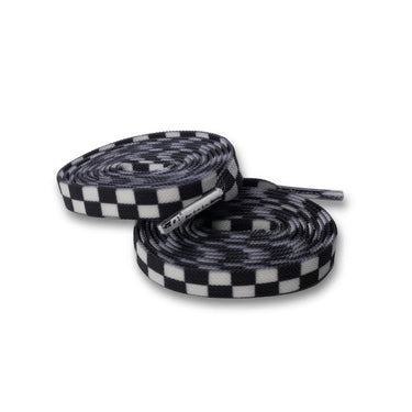 White checkered elastic shoelaces rolled up, featuring a black and white checkerboard pattern.