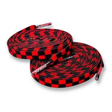 Red and black checkered shoelaces on a white background