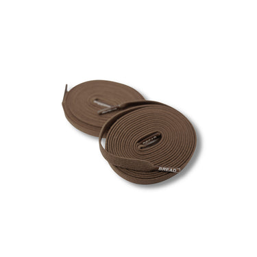 Rich brown elastic shoelaces coiled neatly, featuring a smooth texture and a subtle branding detail.