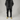 Desert tan elastic shoelaces displayed on a model wearing black pants and a black jacket, standing on a light background.