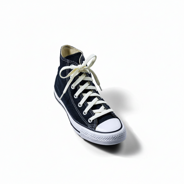 Luxe Creme elastic shoelaces in cream color, styled on a black high-top sneaker with white sole and toe cap.