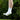 White crew socks with "BREAD" text, worn by a person jumping outdoors against a green background.