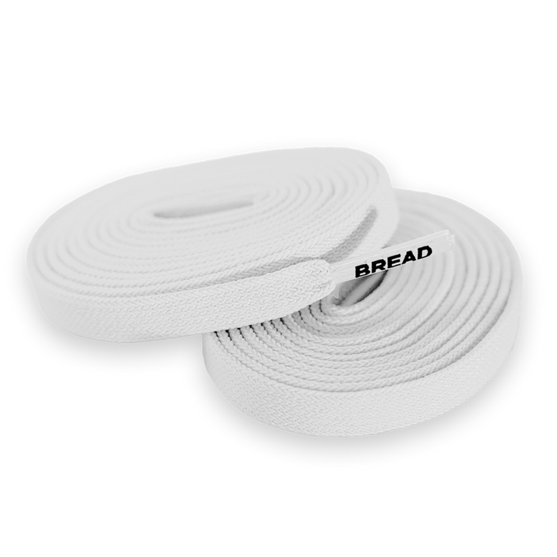 Two rolls of white shoelaces with a 'BREAD' label on a white background